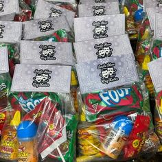 many bags of candy are stacked on top of each other