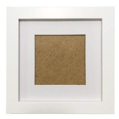 a white frame with a cork board in the middle