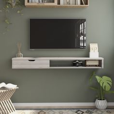 a flat screen tv mounted to the side of a wall