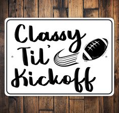 a sign that says classy tii kickoff on it with a football ball