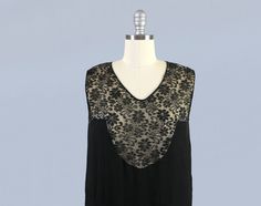 "Gothy Art Deco 1920s dress. Features floral illusion lace yoke in a great design, and black silk base dress with attached chiffon overdress layer. Classic loose, airy flapper fit with dropped v seam waist, drapey neckline, and curved deco shapes. Voluminous angled flutter hem. Back features cutout detail with droopy lace bow. LAYAWAY available; message for details! Measurements: Recommended size M -Bust: 38\" -Dropped waist: 40\" -Length: 46\" Condition: Great. The sheer silk underneath the lac Witchy Dress, 20s Dresses, 1920 Fashion, Dress Art, 1920s Dress, Lancaster Pa, Lace Bows, Art Dress, Dress Measurements