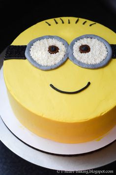 there is a yellow cake with eyes on it