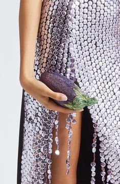 Judith Leiber draws inspiration from her vegetable gardens while paying homage to the beloved emoji with this pavé crystal clutch shaped like an eggplant. Magnetic-snap closure Removable chain strap Structured silhouette Metallic-leather lining Metal/crystal Made in Italy Designer Handbags Judith Leiber Handbags, Judith Leiber Couture, Embellished Clutch, Crystal Clutch, Womens Designer Handbags, Judith Leiber, Metallic Leather, Chain Strap, Eggplant