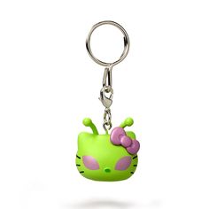 a green hello kitty keychain with a pink bow on it's head