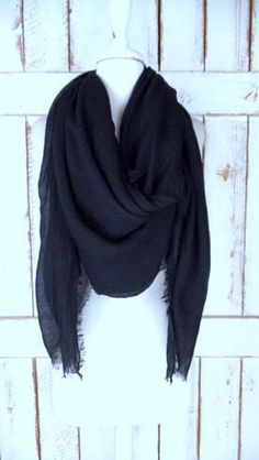 "Handmade large black gauzy crinkled cotton blend wrap shawl scarf/oversized lightweight black scarf/unisex raw hem fringe scarf Measurements... -length: 76\" -width: 56\" Features... -lightweight gauzy cotton/poly blend -raw fringe edges -oversized design perfect for use as a shawl, scarf or cover up -the perfect layering piece -handmade in California -made to order" Black Bohemian Wraps For Winter, Bohemian Black Winter Wrap, Winter Bohemian Black Wrap, Trendy Black Scarf For Fall, Trendy Black Scarves For Fall, Oversized Casual Shawl For Spring, Trendy Black Fall Scarves, Casual Oversized Shawl For Spring, Black Bohemian Scarf For Fall