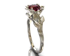 You'll be thrilled with this dazzling, handmade Ruby Engagement Ring. Its vibrantly detailed design and radiant red ruby reflect passion and individuality. Stylish and elegant, it's a look that's sure to stand the test of time and love for each other. This unique ring is made from solid, 14kt white gold that forms a graceful leaf and petals of the lotus flower. A sparkling, round ruby sits at the center, completing the image of a beautiful lotus flower. ★See A Video Of This Amazing Ring Here★ ht Elegant Ruby Ring With Polished Finish, Elegant Silver Ruby Flower Ring, Red Ruby Flower-shaped Ring, Red Ruby Flower Shaped Ring, Flower Shaped Ruby Ring As A Gift, Elegant Ruby Flower Ring In Yellow Gold, Elegant Red Flower Ring With Gemstone, Elegant Flower Shaped Ruby Promise Ring, Elegant Flower-shaped Ruby Promise Ring