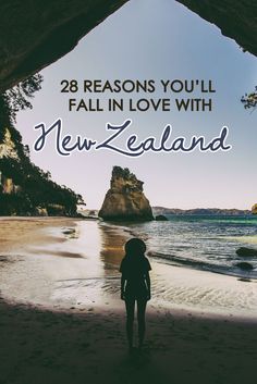 a person standing in front of the ocean with text overlay that reads 28 reasons you'll fall in love with new zealand