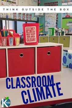 classroom climate poster with red bins and blue lettering on the desk in front of it