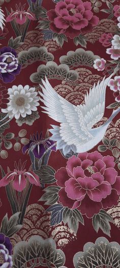 a white bird flying over flowers on a red background