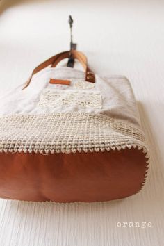 a brown and white bag sitting on top of a table