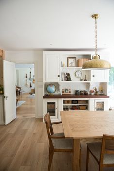 the kitchen is clean and ready to be used as a dining room or living room