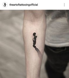 a person with a small tattoo on their arm