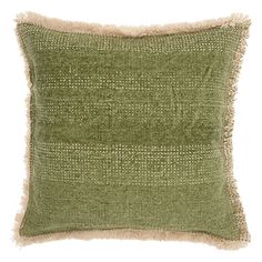 a green pillow with fringes on the front and back of it, against a white background