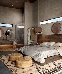 a large bed sitting on top of a rug in a bedroom