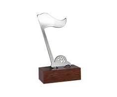 a metal trophy with a dog paw on it's side and a wooden base