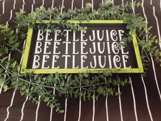 a sign that says beet - le - juice and beetlele juice on it