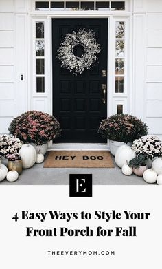 front porch decorated for fall with white pumpkins and flowers