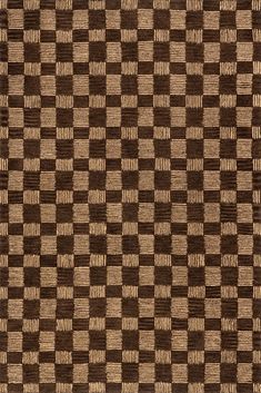 a brown and tan checkered rug with small squares on the bottom, in various sizes