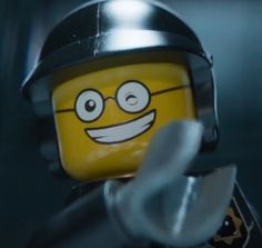 the lego movie character is wearing a helmet