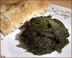 spinach and bread are sitting on a plate