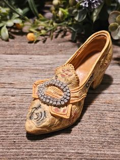 a pair of shoes sitting on top of a wooden table