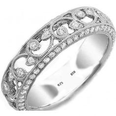 a white gold wedding ring with intricate filigrees and round brilliant cut diamonds