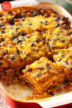 a casserole dish with cheese and black beans in it on a red plate