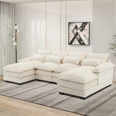 a living room with a large white sectional couch