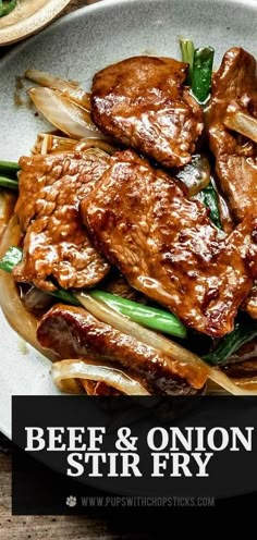 beef and onion stir fry on a white plate