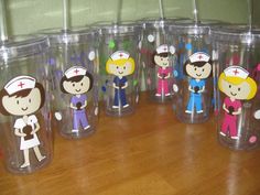 several plastic cups with cartoon figures on them