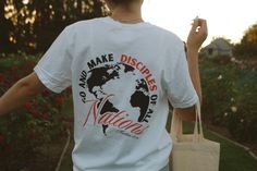 a man carrying a shopping bag with the words make disarrays to nations on it