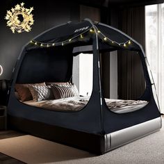 a bed that has some lights on top of it and is in the middle of a room