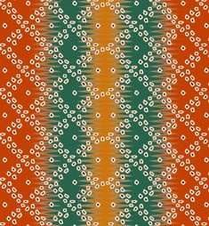 an orange, green and white pattern with small flowers on the bottom half of it