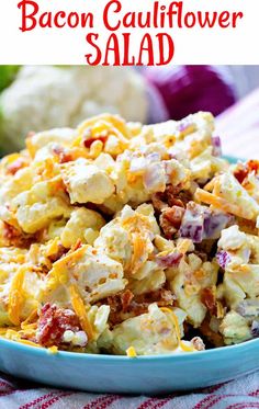 bacon cauliflower salad in a blue bowl on a red and white tablecloth