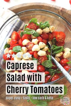 caprese salad with cherry tomatoes, basil and mozzarella cheese in a glass bowl