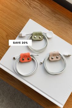 three different colored cords on top of a white box with the words save 20 %