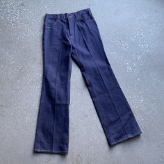 "ABOUT: Vintage 60s/70s Mc Allister brand jeans with metal zipper fly and 5 pocket styling. They have a slight bell at the hemline and are in like new unworn condition with original paper tag at the back  TAG: Mc Allister 100% cotton Mens  TAG SIZE: 32 R  FITS LIKE: 31\" waist x 32\" inseam - see measurements below *Please compare measurements to a like item in your wardrobe that already fits. *No refunds due to improper fit MEASUREMENTS- (taken with garment laying flat in inches, not doubled) waist: 15 1/2\" hip: 19\" thigh width: 10 1/2\" rise: 12\" inseam: 32\" outseam: 43\"  width at hem: 9 1/2\" CONDITION: In great vintage condition with no holes or rips. They have original tag still attached at the back and are clean and ready to wear. See photos for details ALL SALES FINAL POLICIES: Retro Jeans With Standard Cut Leg, Retro Denim Pants With Standard Cut Leg, Vintage Fitted Denim Blue Flare Jeans, Fitted Vintage Denim Blue Flare Jeans, 1970s Fitted Denim Jeans, Retro Denim Blue Jeans, 1970s Style Fitted Denim Jeans, Vintage Fitted Flare Jeans In Denim Blue, Retro Dark Wash Rigid Denim Flare Jeans