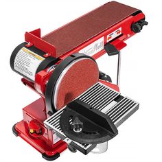 a red bench top grinder on a white background