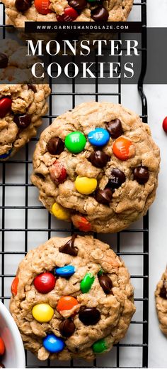 cookies with m & m's and chocolate chips on a cooling rack next to a bowl of candy