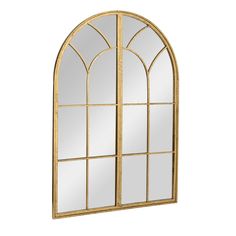 a gold arched window with mirrors on it