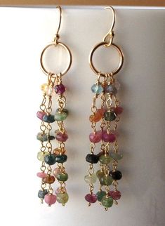 two pairs of dangling earrings with multicolored beads on gold plated earwires