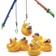 several rubber ducks with hats and fishing hooks