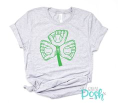 "Baseball Mitt Shirt T-Shirt Clover St Patricks Day Sports Lucky Sport Tee Womens Mom Shamrock Irish Holiday Bella Canvas Graphic Tees Shirts PRODUCT INFO * 90% combed ringspun cotton, 10% polyester * Weight 4.2 Oz * Unisex sizing * Sizes XS, S, M, L, XL, 2XL, 3XL, 4XL ----------------------------- SIZING CHART XS: Body Length 27″ / Body Width 16.5″ / Sleeve Length 8\" S: Body Length 28″ / Body Width 18″ / Sleeve Length 8.25\" M: Body Length 29″ / Body Width 20″ / Sleeve Length 8.63\" L: Body Le Halloween Costumes For Work, Baseball Mitt, Holiday Attire, Shamrock Shirt, Costume Shirts, Cricut Craft, Gildan Sweatshirts, Sport T-shirts, Sports Tees