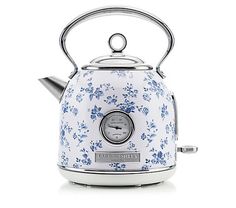 a blue and white tea kettle on a white background