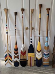 several paddles are lined up against the wall