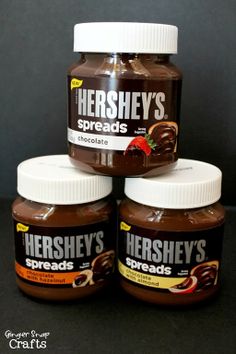 three jars of hershey's spread are stacked on top of eachother