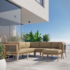 an outdoor living area with furniture and plants