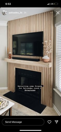 a flat screen tv mounted to the side of a fireplace