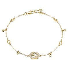 Gucci Interlocking G 18ct Yellow Gold 0.20ct Diamond Bracelet YBA729403002017 The Interlocking G jewellery collection takes a cue from the geometric logo, resulting in this design. Sparkling with Interlocking G details and set with diamonds, the 18ct yellow gold bracelet is ideal for everyday wear. - 18ct yellow gold - 30 diamonds, approximately 0.2ct - Interlocking G - Made in Italy Gucci Yellow Gold Bracelet For Formal Occasions, Gucci Elegant Yellow Gold Bracelet, Designer Gold Bracelets With Brilliant Cut, Elegant Gucci Bracelets For Formal Occasions, Gucci Jubilee Bracelet Jewelry Gift, Elegant Gucci Formal Bracelets, Gucci White Gold Jewelry With Diamond Accents, Gucci Diamond Jewelry For Anniversary, Gucci Fine Jewelry In Yellow Gold