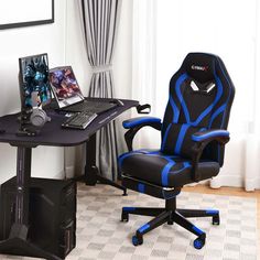 a black and blue office chair sitting in front of a computer desk